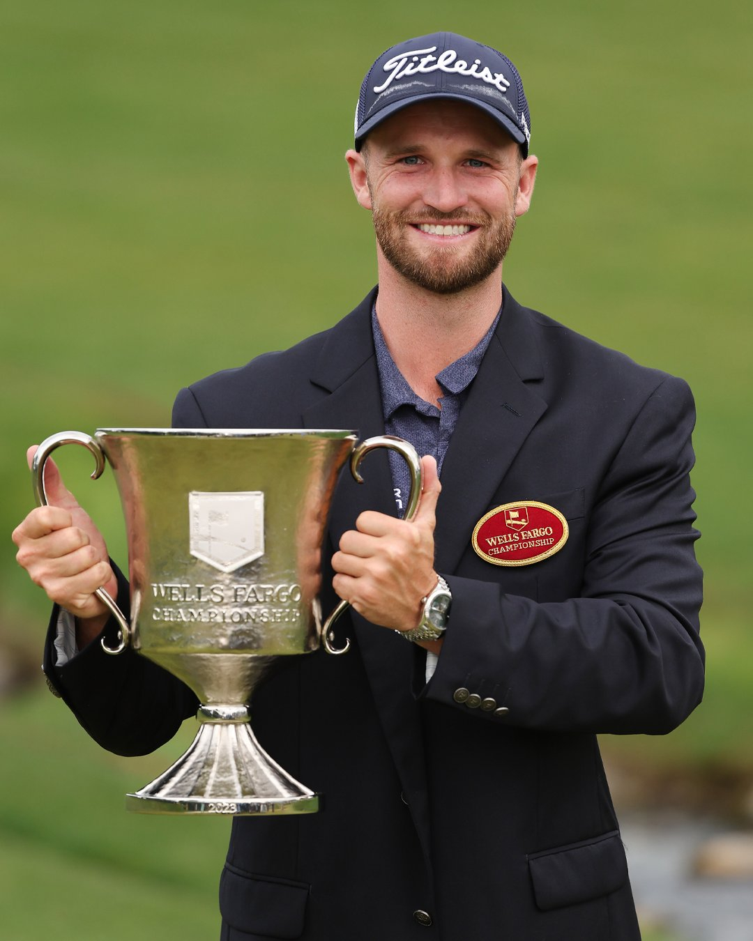 Wells Fargo Championship winner Wyndham Clark holding trophy made by Malcolm DeMille